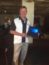 HP's Brian Boyle shows off a Windows 10 laptop during Thursday's partner event in Boston.